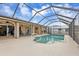 Inviting screened pool area with ample deck space at 420 Chamber Nw St, Port Charlotte, FL 33948