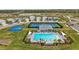 Aerial view of community pool, pickleball, and basketball courts at 44259 Saddlewood Ct, Punta Gorda, FL 33982