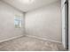 Bedroom with carpet, window, and ample wall space at 44259 Saddlewood Ct, Punta Gorda, FL 33982