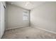 Well-lit bedroom featuring carpet flooring and a window at 44259 Saddlewood Ct, Punta Gorda, FL 33982