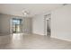 Bright living room with tile floors and sliding glass doors leading to a patio at 44259 Saddlewood Ct, Punta Gorda, FL 33982