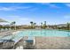 Resort-style pool with plenty of lounge chairs for sunbathing at 44259 Saddlewood Ct, Punta Gorda, FL 33982