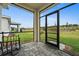 Screened-in porch with paver flooring and backyard view at 44259 Saddlewood Ct, Punta Gorda, FL 33982