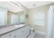 Bathroom features a vanity with granite countertop and a shower/tub combo at 4522 Mckay St, North Port, FL 34286