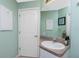 Guest bathroom with single vanity and additional storage at 4522 Mckay St, North Port, FL 34286