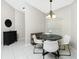 Dining room with round table, chairs, and decorative sideboard at 4522 Mckay St, North Port, FL 34286