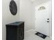 Home entryway with a black cabinet and a welcome mat at 4522 Mckay St, North Port, FL 34286