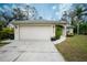 View of the house's garage and driveway at 4522 Mckay St, North Port, FL 34286