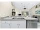 Kitchen features a double sink, granite countertops, and stainless steel dishwasher at 4522 Mckay St, North Port, FL 34286