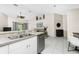 Kitchen with stainless steel appliances, granite countertops, and view of living room at 4522 Mckay St, North Port, FL 34286