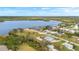 Wide aerial showcasing waterfront community and lush landscape at 500 Woodstork Ln, Punta Gorda, FL 33982