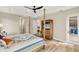 Bedroom with a queen-size bed, dresser, and backyard access at 500 Woodstork Ln, Punta Gorda, FL 33982