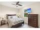 Guest bedroom with a comfortable bed and built-in dresser at 500 Woodstork Ln, Punta Gorda, FL 33982