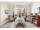 Bright dining room with large windows and a stylish chandelier at 500 Woodstork Ln, Punta Gorda, FL 33982