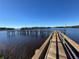 Wooden dock extending into the calm water at 500 Woodstork Ln, Punta Gorda, FL 33982