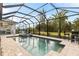 Relaxing screened-in pool and spa with outdoor kitchen at 500 Woodstork Ln, Punta Gorda, FL 33982