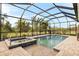 Spacious screened pool and spa with adjacent patio at 500 Woodstork Ln, Punta Gorda, FL 33982