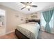 Cozy bedroom featuring a full-size bed and adjacent bathroom at 526 Allen St, Punta Gorda, FL 33950