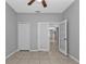 Spacious bedroom with double doors opening to living area at 5547 Wagon Wheel Dr, North Port, FL 34291