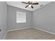 Bright bedroom with ceiling fan and tile floors at 5547 Wagon Wheel Dr, North Port, FL 34291