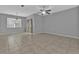 Dining area with tile floor, window, and ceiling fan at 5547 Wagon Wheel Dr, North Port, FL 34291