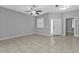 Bright living room with tile floors and ceiling fan at 5547 Wagon Wheel Dr, North Port, FL 34291