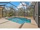 Inviting screened pool with ample surrounding space at 5547 Wagon Wheel Dr, North Port, FL 34291