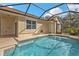 Relaxing screened pool area adjacent to house at 5547 Wagon Wheel Dr, North Port, FL 34291