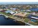 Aerial view of waterfront home with pool and private dock at 625 Via Tunis, Punta Gorda, FL 33950