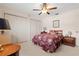 Spacious bedroom with floral bedding and nightstand at 625 Via Tunis, Punta Gorda, FL 33950