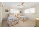 Guest bedroom with twin beds and ceiling fan at 625 Via Tunis, Punta Gorda, FL 33950