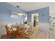 Bright dining room with glass table and wicker chairs at 625 Via Tunis, Punta Gorda, FL 33950