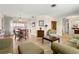 Bright dining area with wood table and access to living room at 625 Via Tunis, Punta Gorda, FL 33950