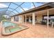 Inviting pool and spa with screened enclosure at 625 Via Tunis, Punta Gorda, FL 33950