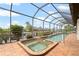 Relaxing screened-in pool and spa overlooking the canal at 625 Via Tunis, Punta Gorda, FL 33950