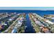 Aerial view of houses along a canal with boats and lush landscaping at 66 Ocean Dr, Punta Gorda, FL 33950