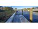 Concrete boat dock offering convenient water access and picturesque canal views at 66 Ocean Dr, Punta Gorda, FL 33950