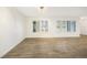 Living room with tile floors and large windows with plantation shutters at 66 Ocean Dr, Punta Gorda, FL 33950