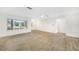 Bright living room featuring tile floors and plantation shutters at 66 Ocean Dr, Punta Gorda, FL 33950