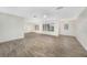 Living room with tile floors, plantation shutters, and ceiling fan at 66 Ocean Dr, Punta Gorda, FL 33950