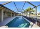 Screened-in pool and canal views at 66 Ocean Dr, Punta Gorda, FL 33950