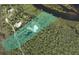 Aerial view of the property showcasing the home's location, landscaping, and proximity to the river at 700 N River Rd, Venice, FL 34293