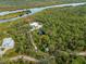 Aerial view of the house, showcasing the property and waterfront access at 700 N River Rd, Venice, FL 34293