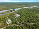 Aerial view showing house, private dock, and waterfront access at 700 N River Rd, Venice, FL 34293