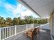 Relaxing deck with wooden chairs overlooking lush greenery at 700 N River Rd, Venice, FL 34293