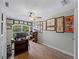 Bright home office features built-in shelving and hardwood floors at 700 N River Rd, Venice, FL 34293