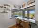 Kitchen nook with a view of the pool and backyard at 700 N River Rd, Venice, FL 34293