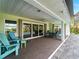 Covered patio overlooking the refreshing pool and lush landscaping at 700 N River Rd, Venice, FL 34293