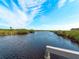 Calm waterway view with lush vegetation at 700 N River Rd, Venice, FL 34293