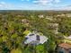 Home with solar panels and pool, aerial view at 7563 Albert Tillinghast Dr, Sarasota, FL 34240